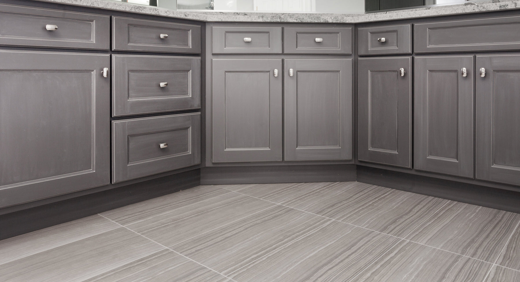 Grey Shaker base cabinets in a modern kitchen